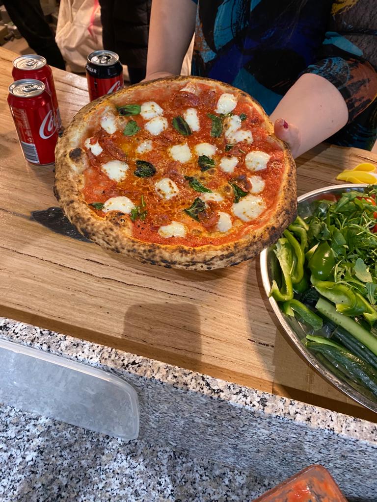 Wood-fired pizza from authentic Italian restaurant pizzeria